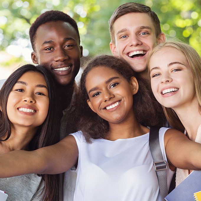 A group of smiling young teens